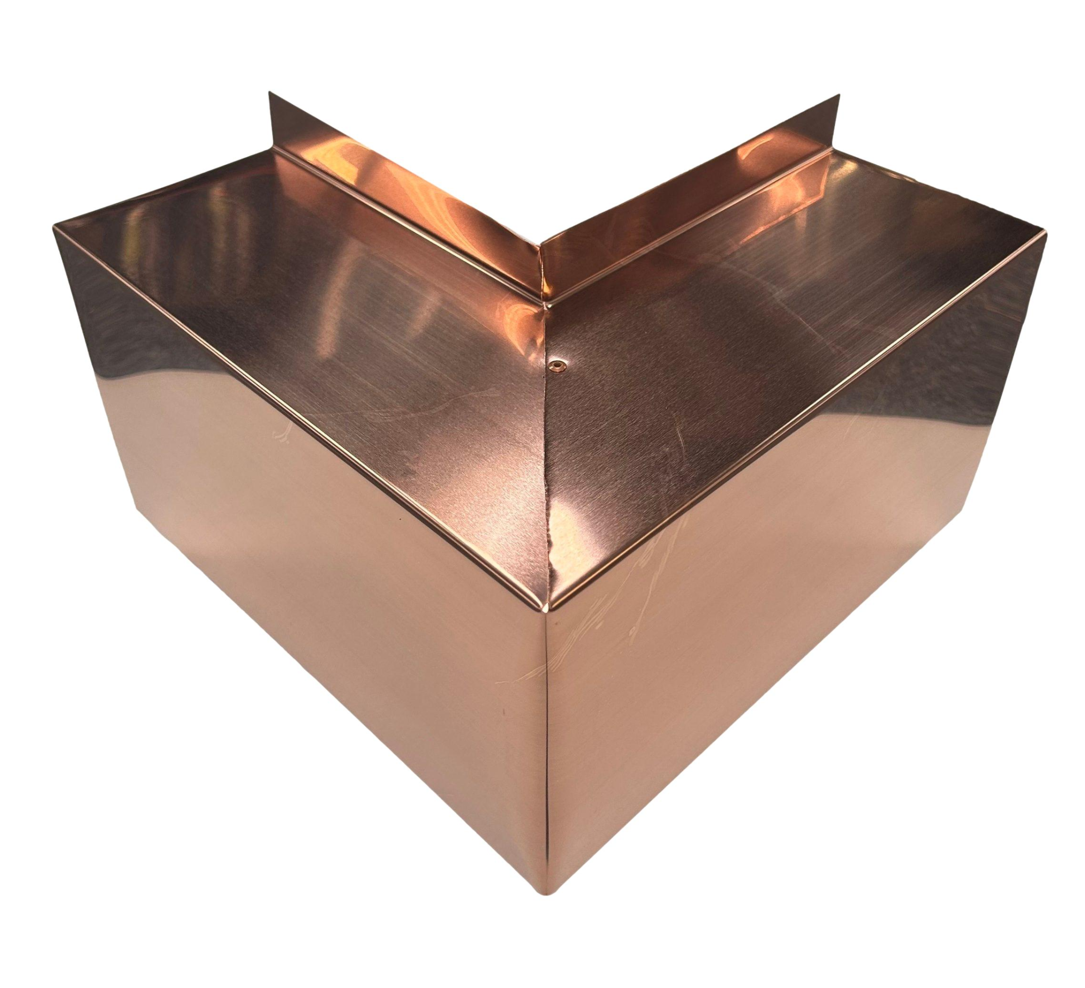 A PermaCover Metal HVAC Line Set Cover Outside Corner Elbow that is made to attach to exterior walls to cover existing HVAC line sets. The elbow cover made from 16 Ounce Pure Copper.