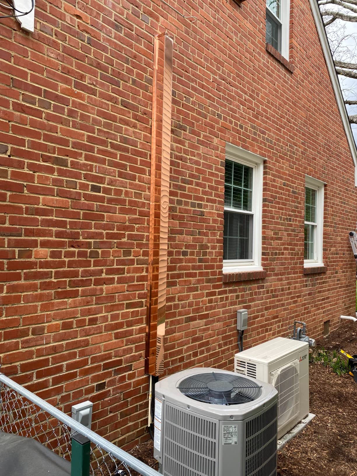 Line Set Cover installed on HVAC unit.