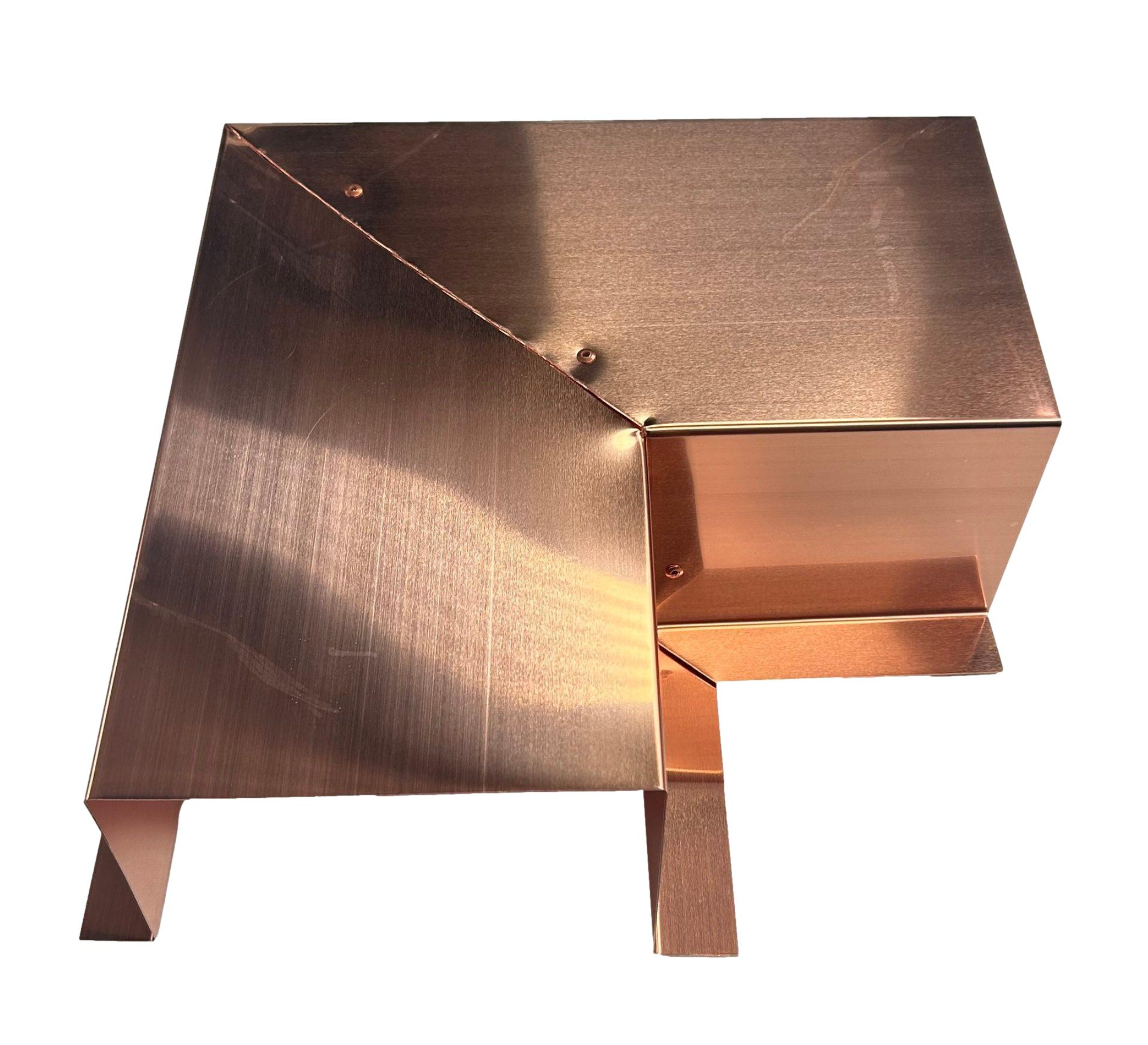 A PermaCover Metal HVAC Line Set Cover 90° Side Turning Elbow that is made to attach to exterior walls to cover existing HVAC line sets. The elbow is made from 16 Ounce pure copper.
