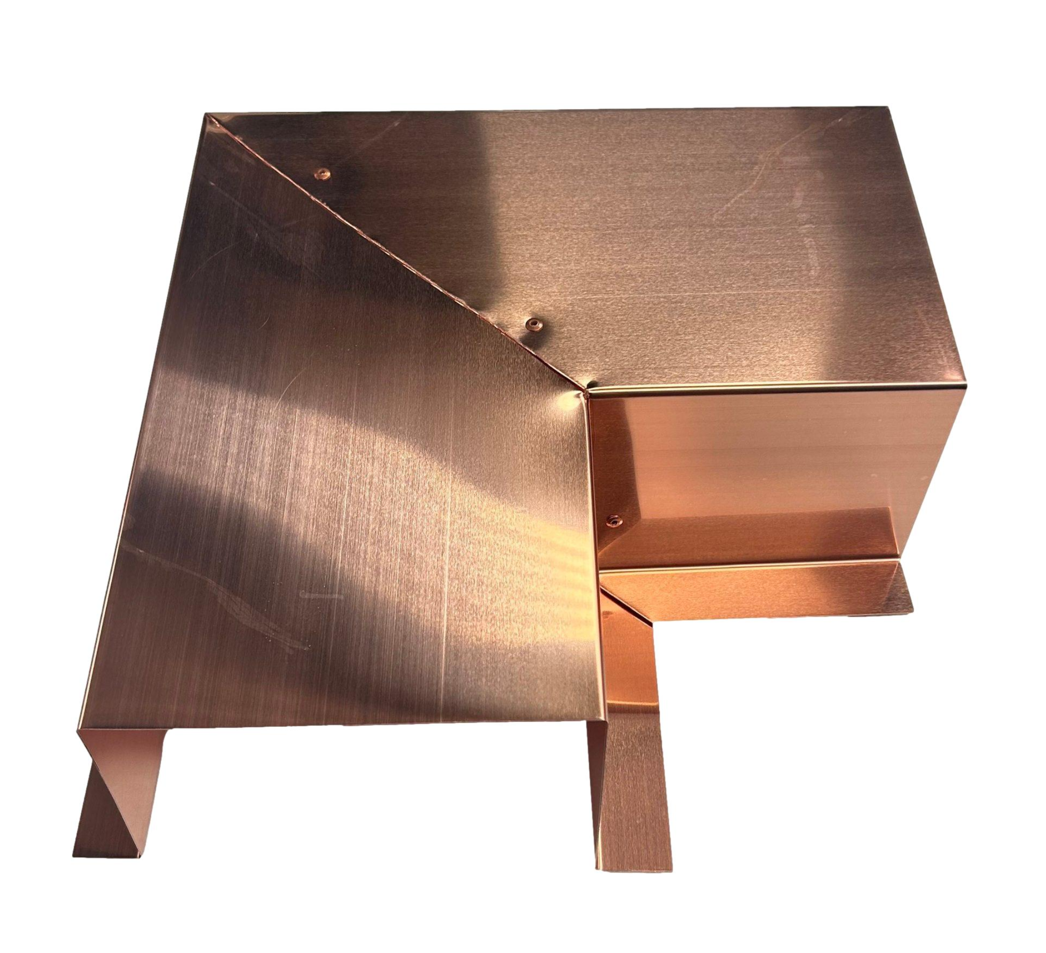 A PermaCover Metal HVAC Line Set Cover 90° Side Turning Elbow that is made to attach to exterior walls to cover existing HVAC line sets. The elbow cover is made from 20 ounce copper metal. 